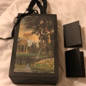 Gucci shopping bag with two gift receipt envelopes
